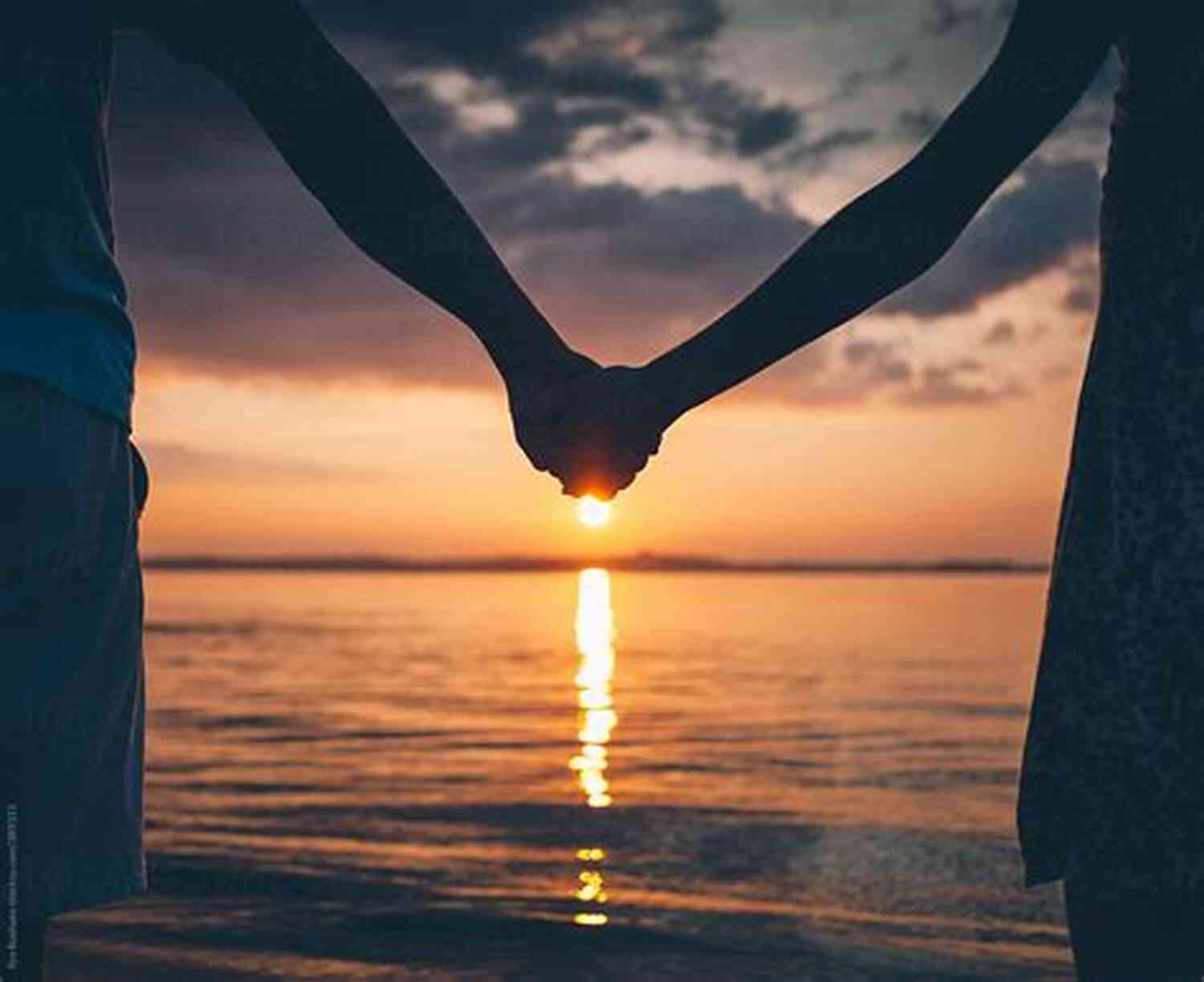 Couple Holding Hands And Enjoying A Sunset On A Beach Keeping Your Connection: 3 Essential Relationship Skills